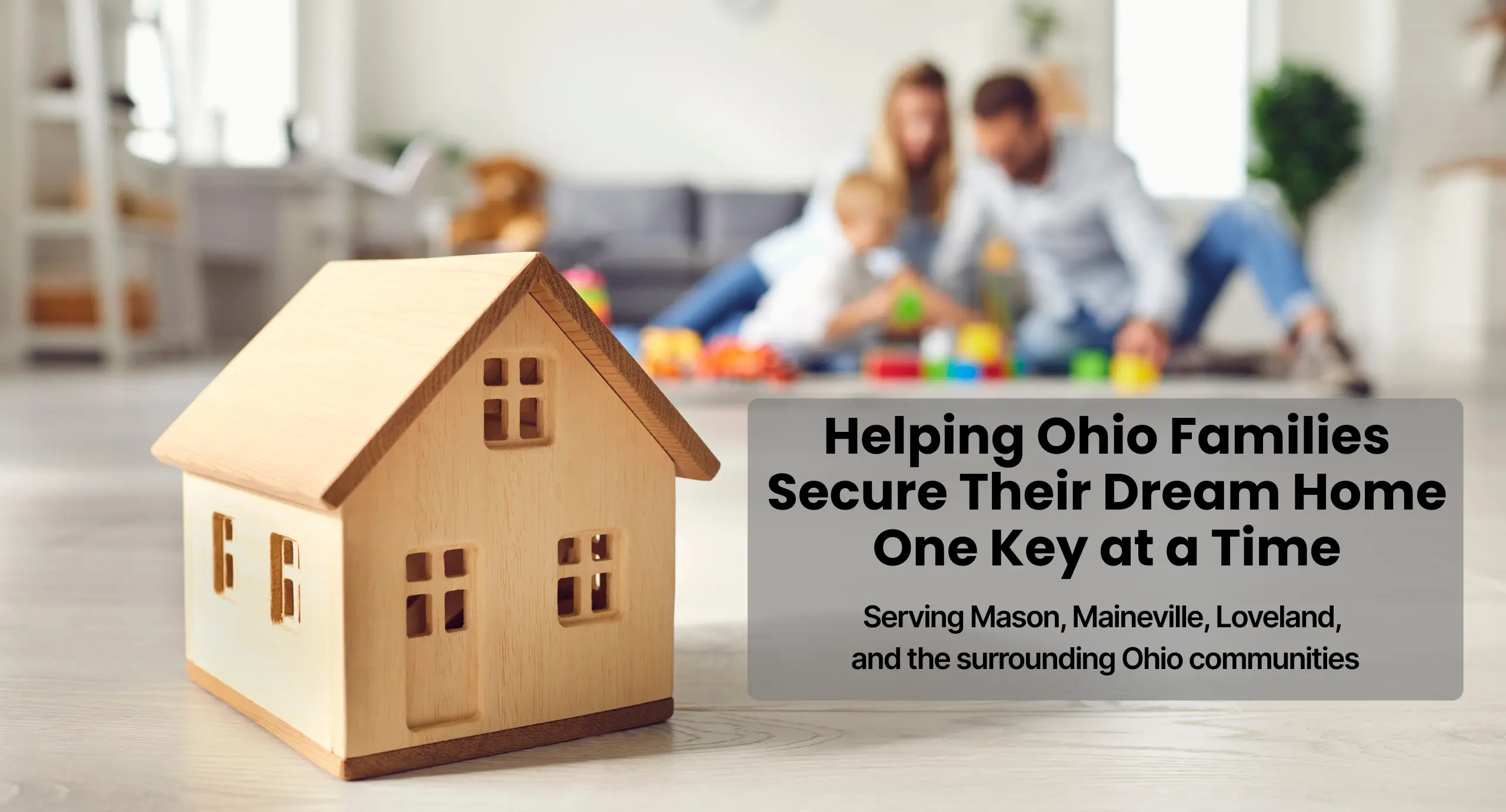Wooden house on table symbolizing home buying in Mason and Maineville